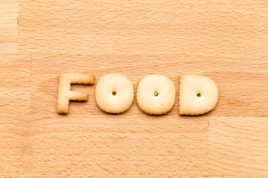 Word food cookie over the wooden background