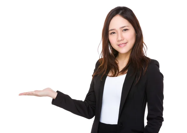 Asian businesswoman with open hand palm — Stockfoto