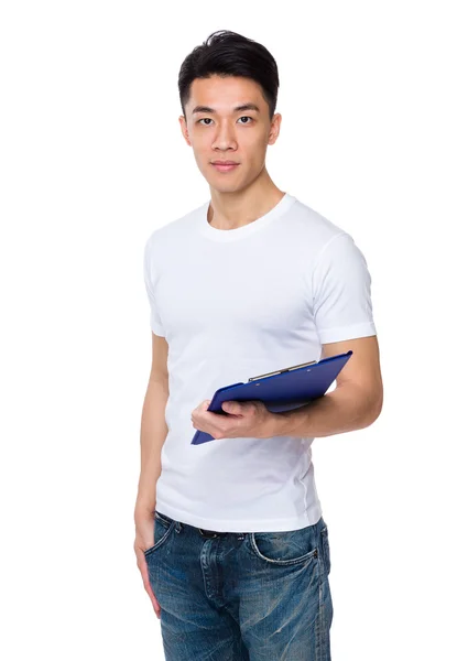 Young asian man holding clipboard — Stock Photo, Image