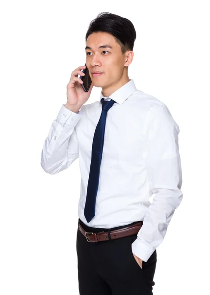 Asian businessman talking cellphone — Stock Photo, Image