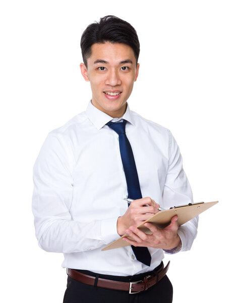 Asian businessman take note on clipboard