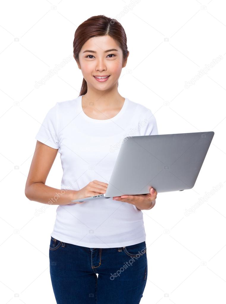 Asian woman using the notebook computer