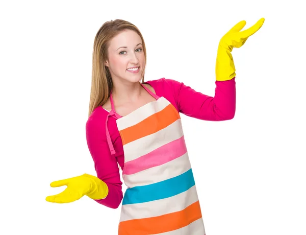 Caucasian woman using the rubber gloves on hand — Stockfoto