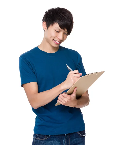 Man take notes on clipboard — Stock Photo, Image