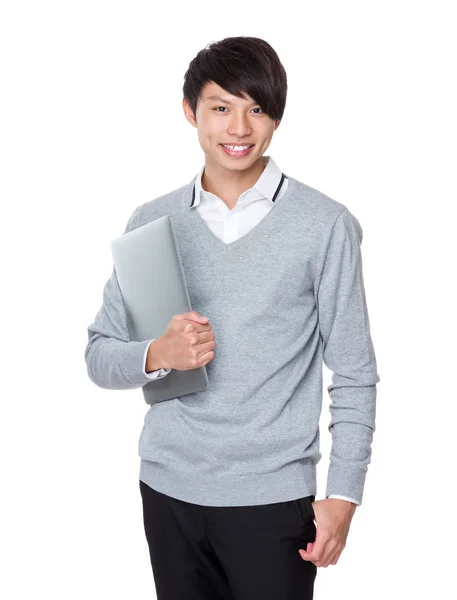 Young businessman holding  laptop — Stock Photo, Image