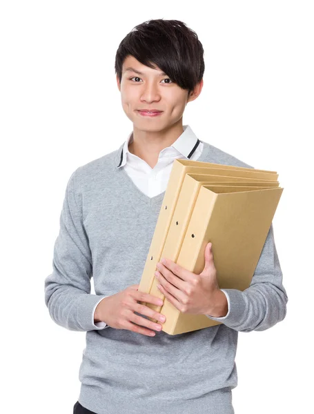 Young businessman holding folders — Stock Photo, Image