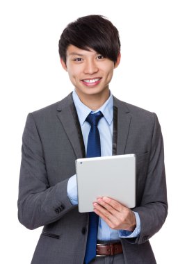 Young businessman using  the tablet pc