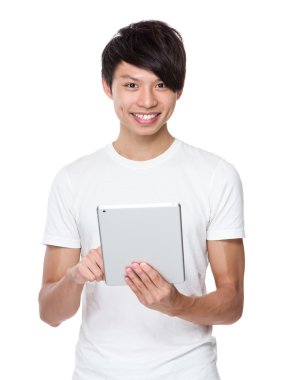 Asian young man using  the tablet pc
