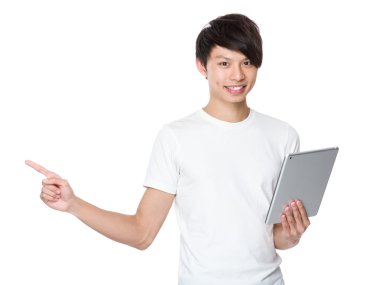 Young man holding the digital tablet