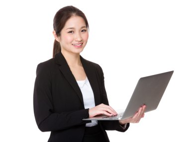 Young businesswoman using the notebook