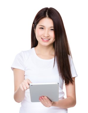 Young woman using the digital tablet pc