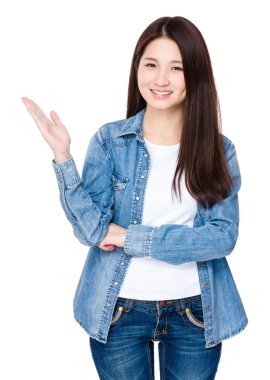 Young woman with hand selling something