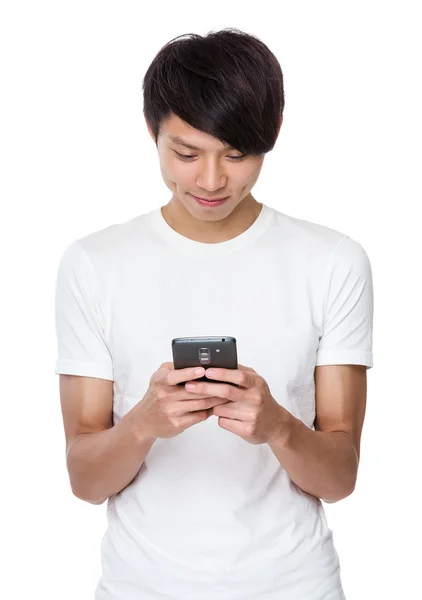 Young university student using the mobile phone — Stockfoto