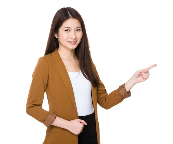 Businesswoman finger point aside for selling product — ストック写真