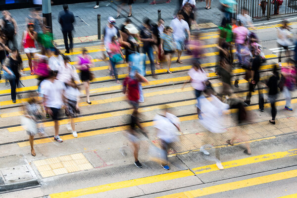 people on zebra crossing busy street