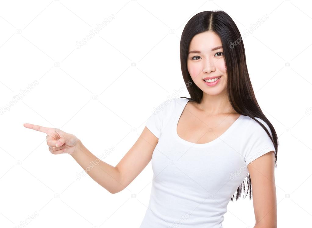 Asian woman with finger point aside