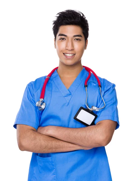 Asijské pohledný doktor v modré uniformě — Stock fotografie