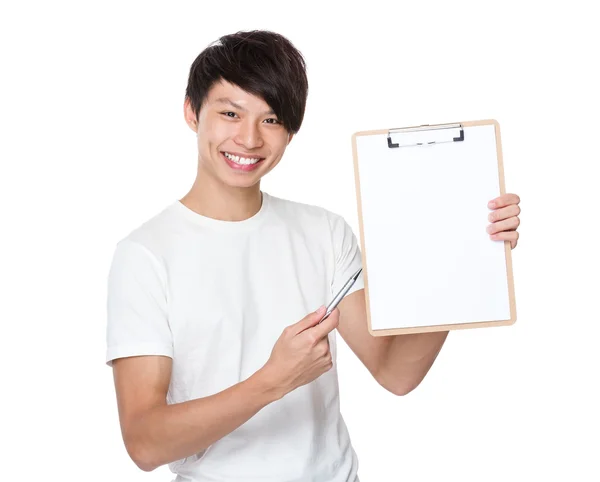 Young man pointing  to blank page — Stock Photo, Image