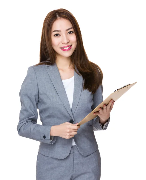 Businesswoman holding clipboard — Stock Photo, Image