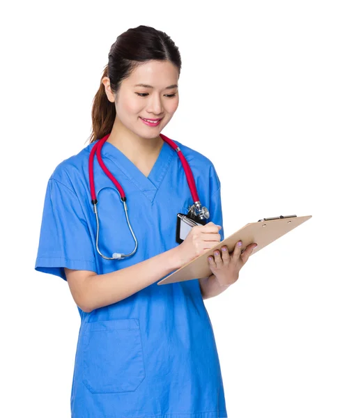 Asiático feminino médico em azul esfrega — Fotografia de Stock