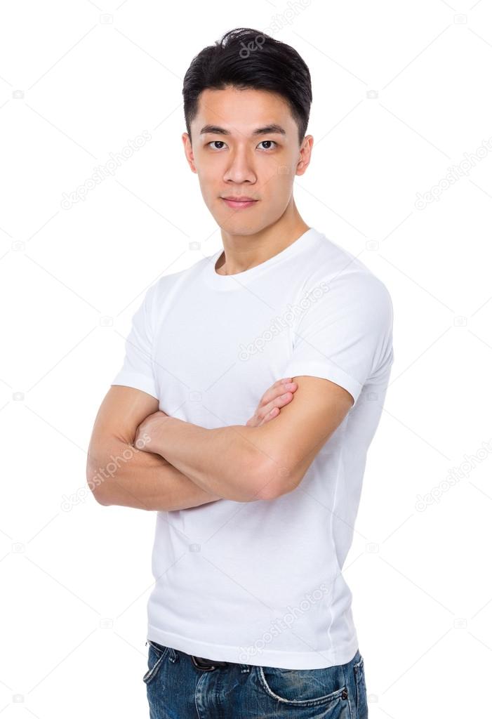 Asian young man in white t-shirt with arms crossed