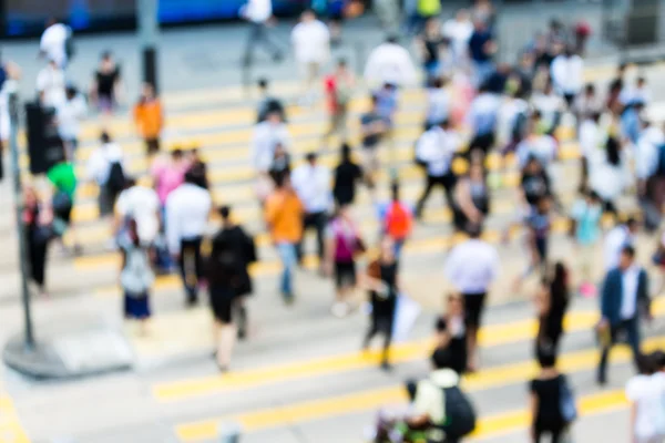 Crosswalk and pedestrians at street in Hong Kong