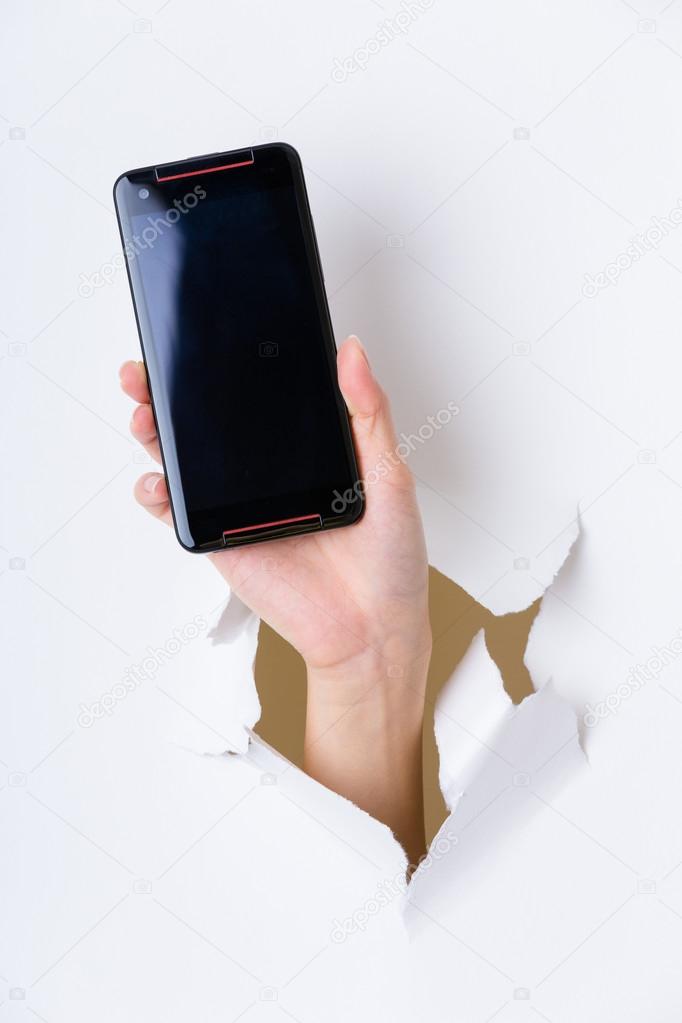 Hand with blank screen of cellphone
