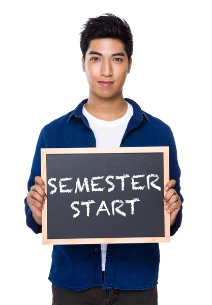 Indian man in blue shirt with chalkboard — Stock Photo, Image