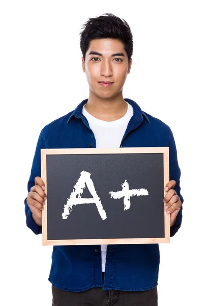 Indian man in blue shirt with chalkboard — Stock Photo, Image