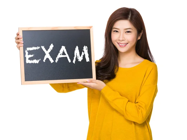 Asian woman in yellow sweater with blackboard — Stock Photo, Image