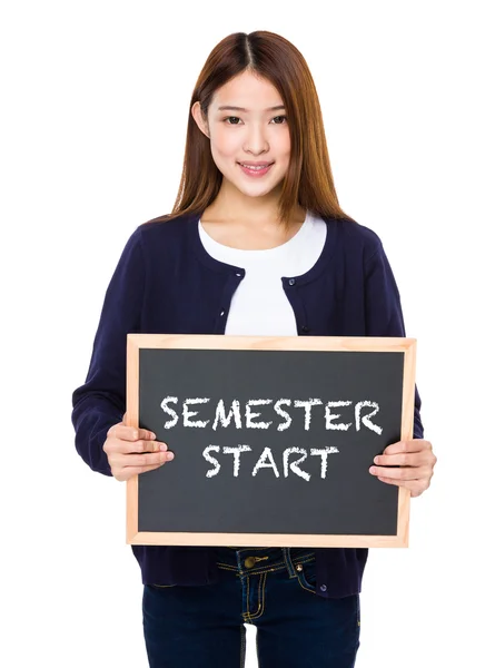 Asian woman in blue cardigan with blackboard — Stock Photo, Image