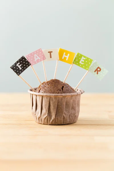 Chocolate muffins with small flag of a word father — Stock Photo, Image