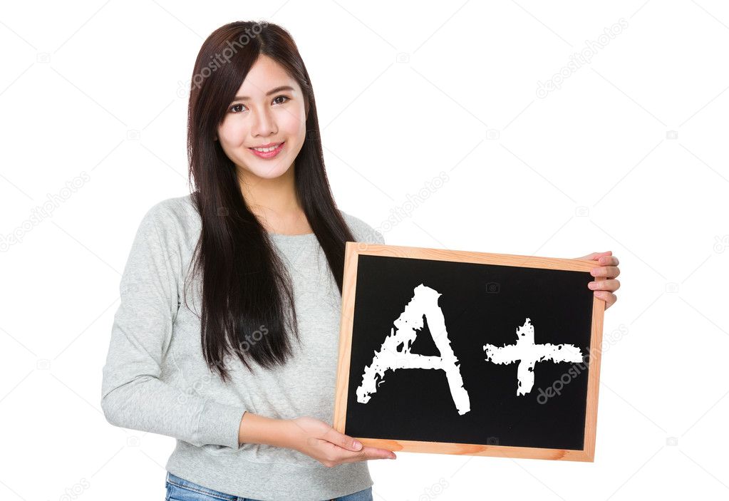 asian woman in grey sweater with blackboard