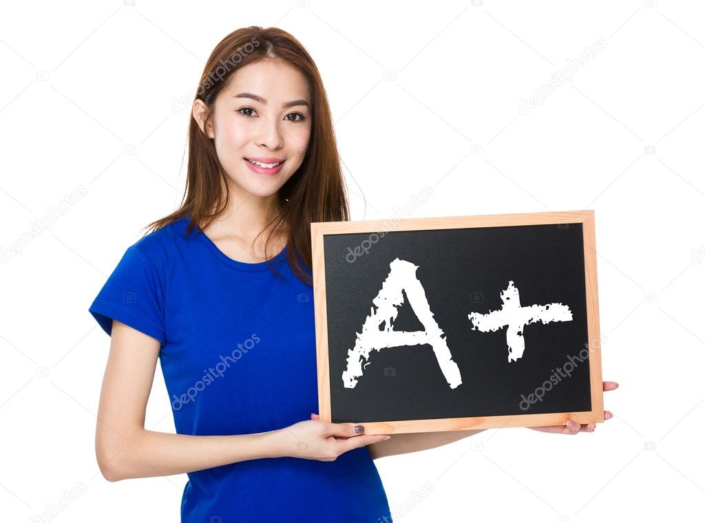 asian woman in blue t-shirt with blackboard