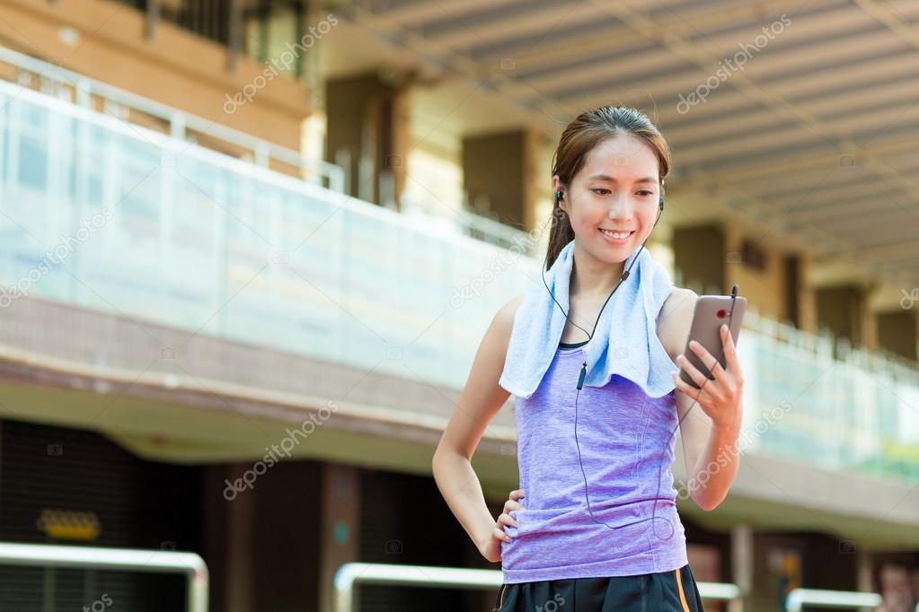 Woman listen to song with mobile phone