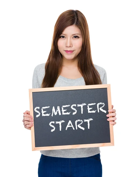 Asian woman in grey sweater with blackboard — Stock Photo, Image