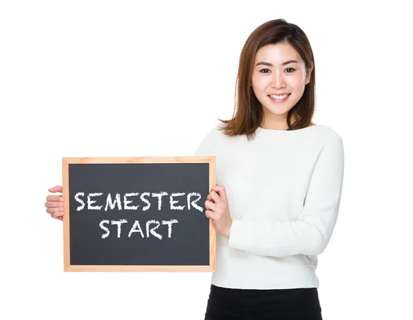 Asian woman in white sweater with the blackboard — Stock Photo, Image