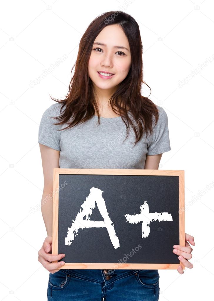 Asian woman in grey t-shirt with blackboard