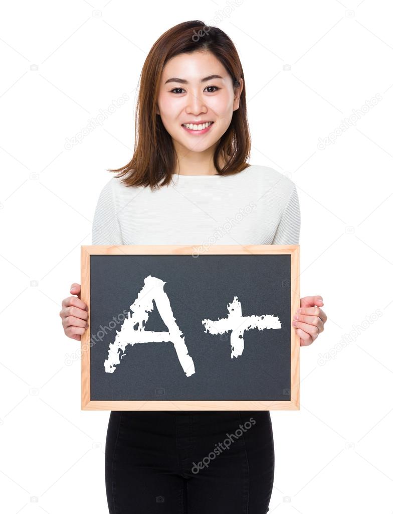 asian woman in white sweater with the blackboard