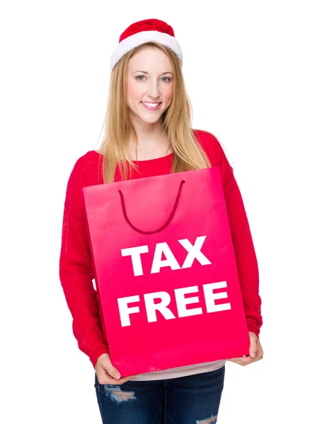 Woman in Christmas hat with paper bag — Stock Photo, Image