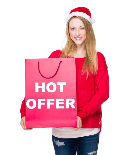 Mujer en sombrero de Navidad con bolsa de papel —  Fotos de Stock