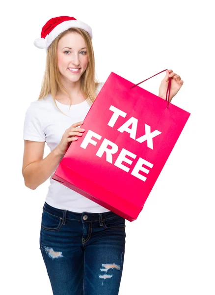 Woman in santa hat with shopping bag — Stock Photo, Image