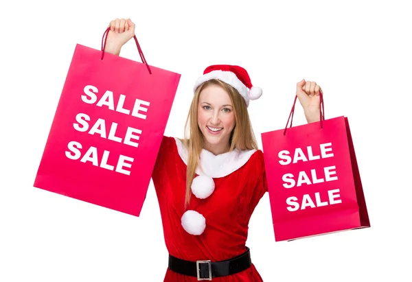 Mujer en traje de Navidad con bolsas de compras —  Fotos de Stock