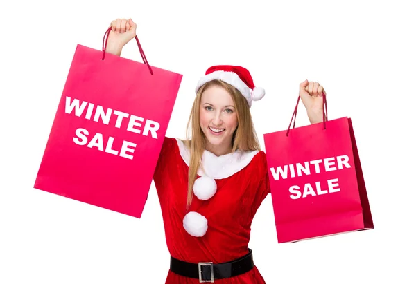 Mujer en traje de Navidad con bolsas de compras —  Fotos de Stock