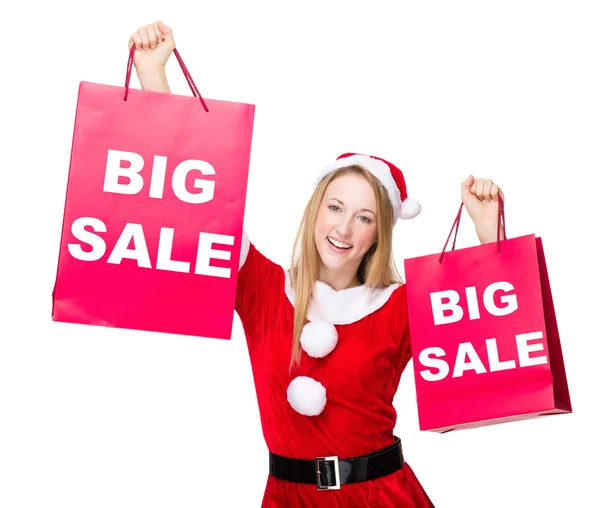 Mujer en traje de Navidad con bolsas de compras — Foto de Stock