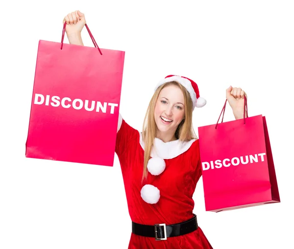 Mujer en traje de Navidad con bolsas de compras —  Fotos de Stock