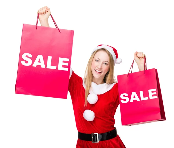 Mujer en traje de Navidad con bolsas de compras —  Fotos de Stock