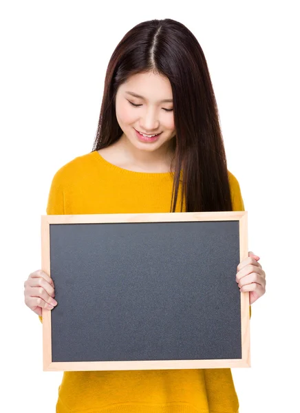 Asian young woman in yellow sweatshirt — Stock Photo, Image