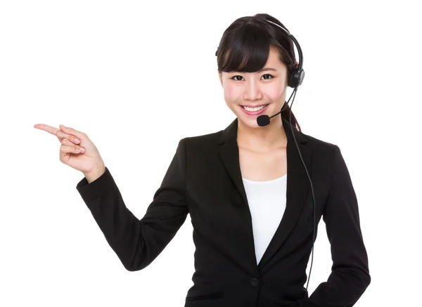 Operador de call center apontando para cima — Fotografia de Stock