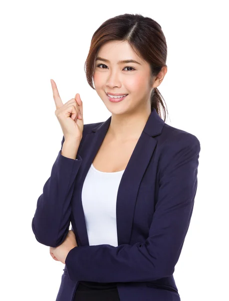 Asian businesswoman pointing up — Stock Photo, Image